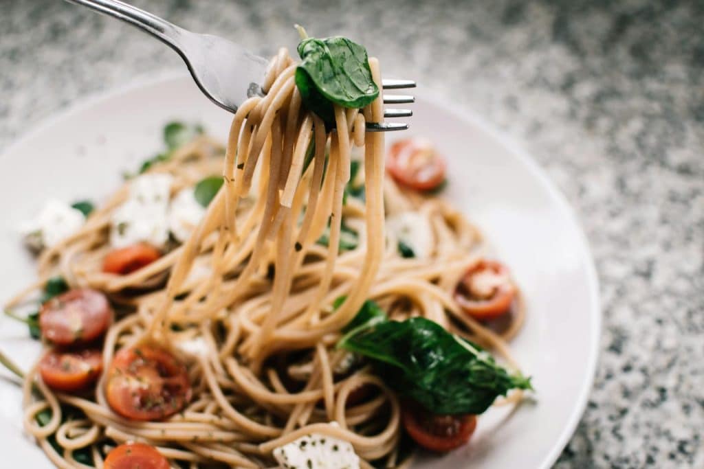 Pasta with tomato and basil is part of a unique diet strategy
