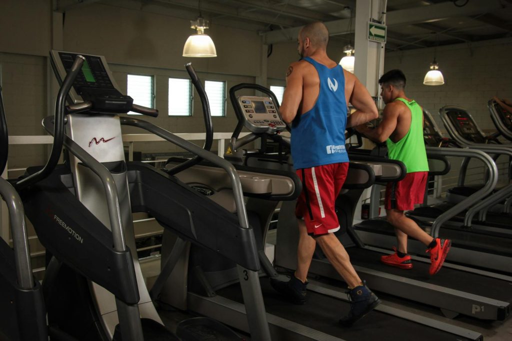 Men master indoor running with limited space inside on a treadmill