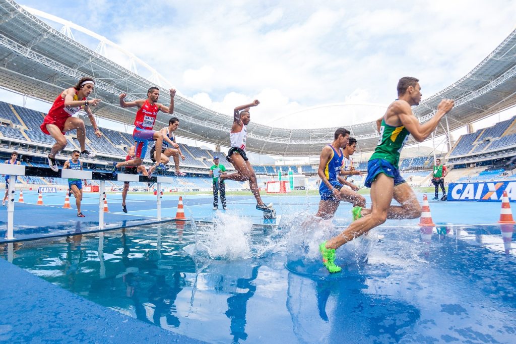 Athletes running outdoors in a competition